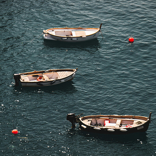 Two small boats on a lake.